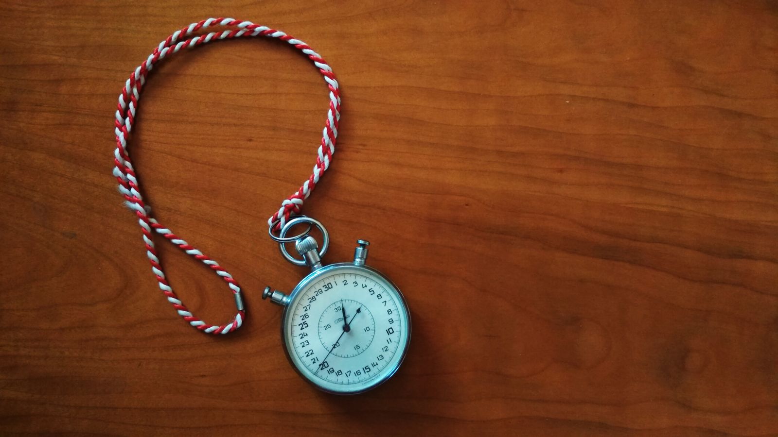 Analog stopwatch on a wooden table